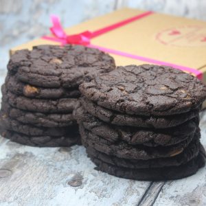 A gluten-free baking kit with all the dry ingredients and instructions for making 12 deliciously decadent black and gold chocolate cookies