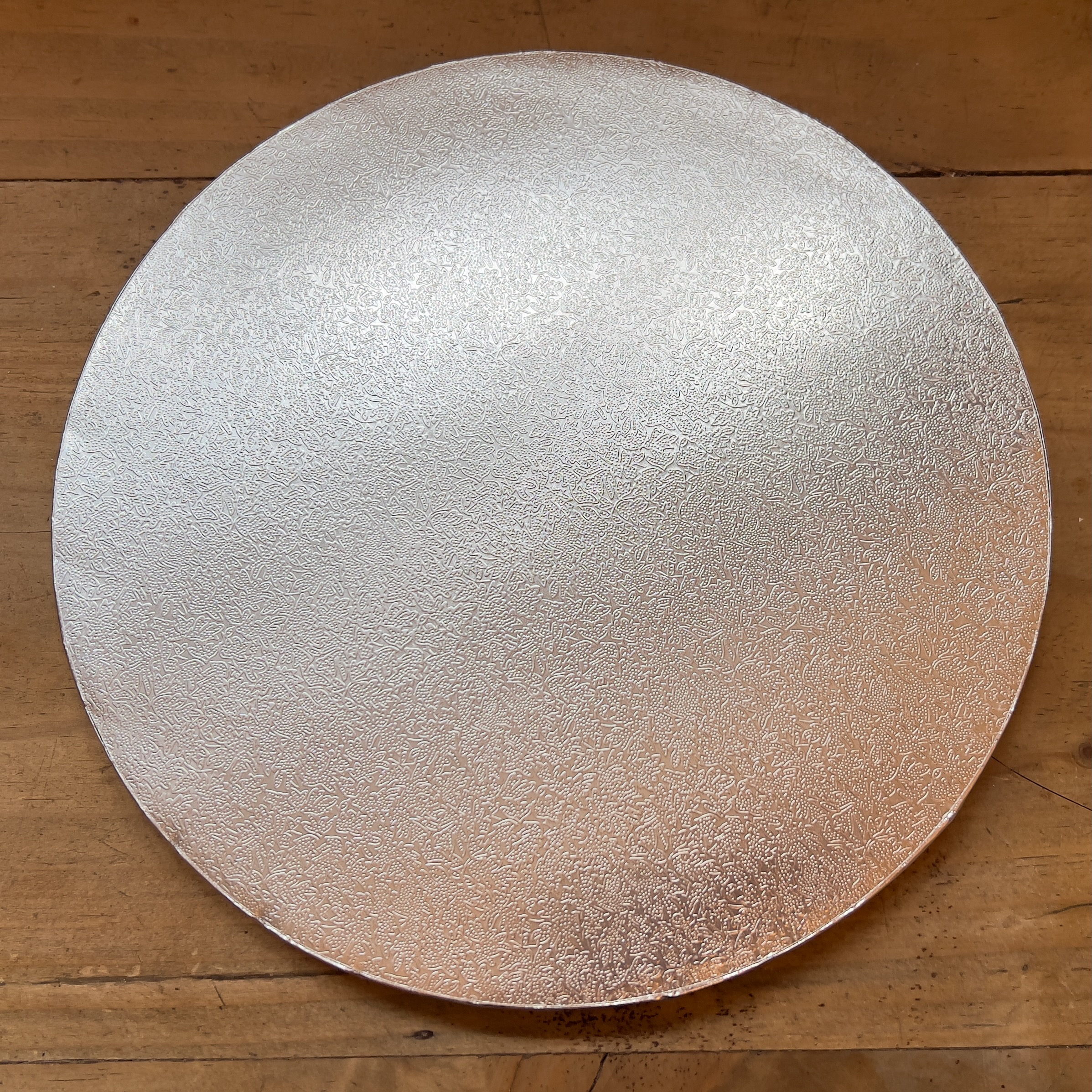 10” round cake board (otherwise known as a cake drum).